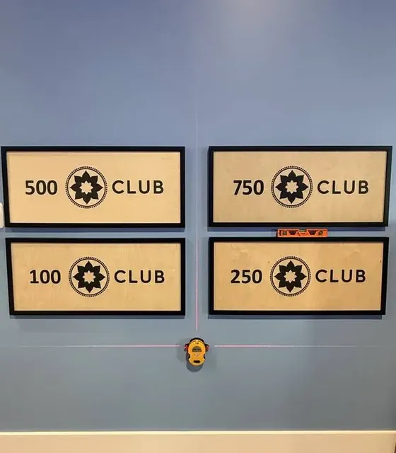 Wall signs hung level with a laser by Haul Hunters