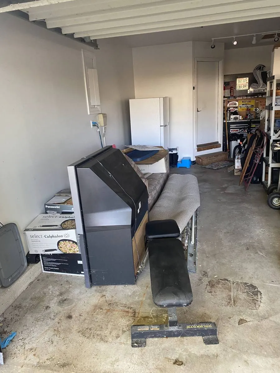 Cluttered garage before