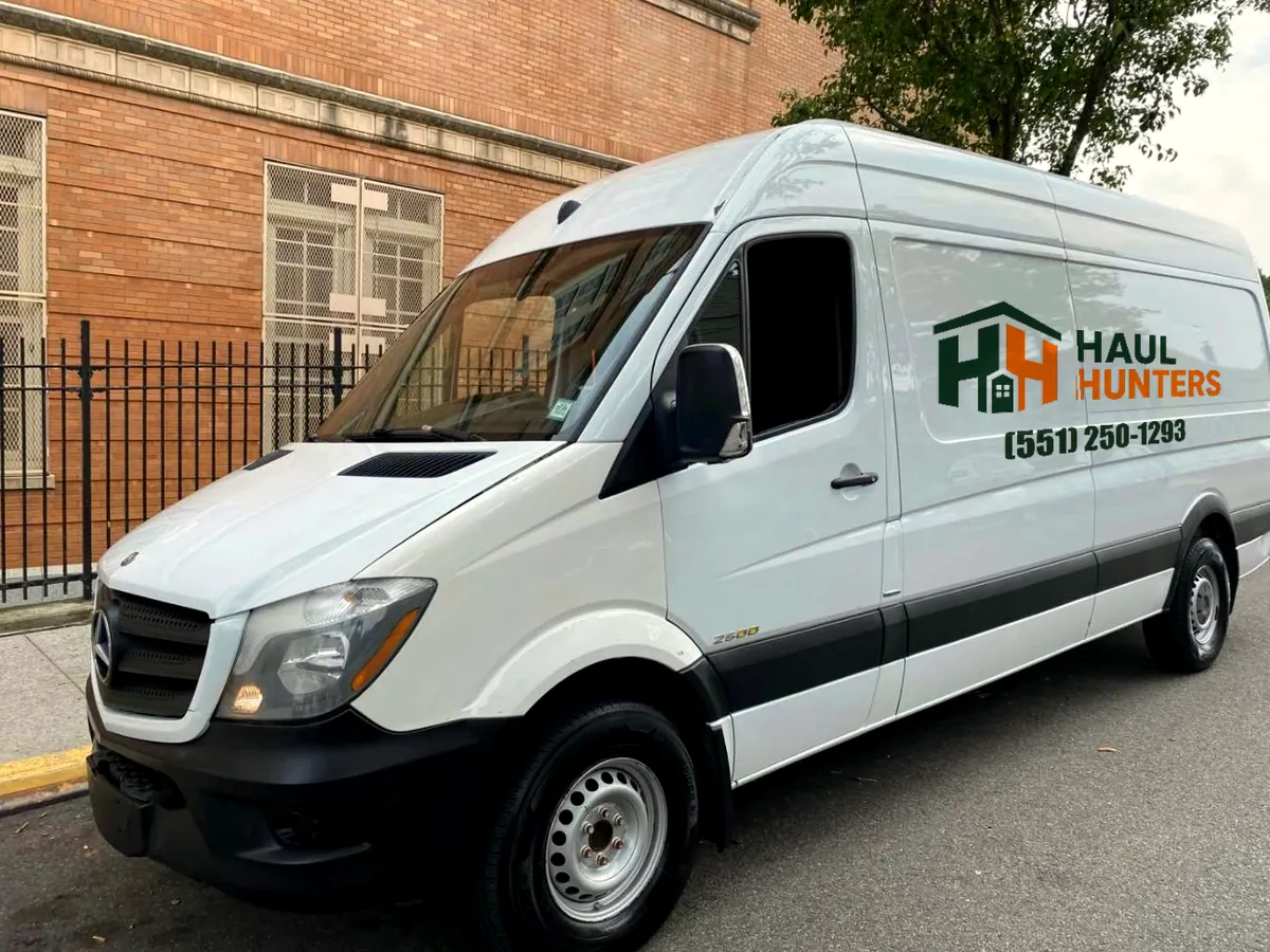 Haul Hunters Mercedes Sprinter van with company logo